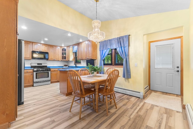 1697 Shore Dr, Arthur Twp, MN 55051 - dining space featuring light wood-style floors, a baseboard heating unit, a chandelier, and recessed lighting