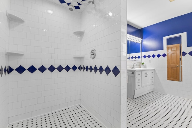 1697 Shore Dr, Arthur Twp, MN 55051 - bathroom featuring vanity, tile walls, tiled shower, and tile patterned flooring