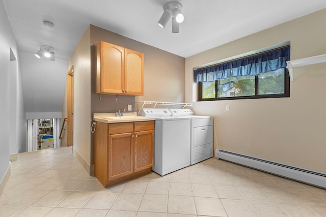 1697 Shore Dr, Arthur Twp, MN 55051 - laundry area with washer and dryer, a baseboard heating unit, light tile patterned floors, cabinet space, and ceiling fan
