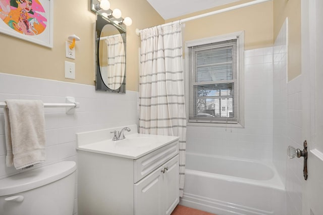 full bathroom featuring vanity, tile walls, shower / bath combination with curtain, and toilet