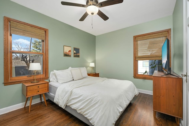 bedroom with ceiling fan and dark hardwood / wood-style flooring