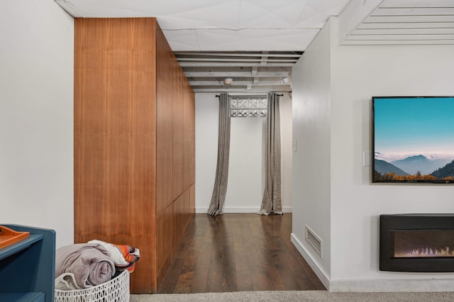 hallway with dark hardwood / wood-style floors