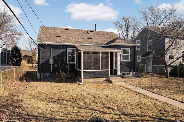 back of house featuring a sunroom