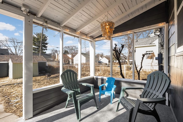 sunroom / solarium with lofted ceiling with beams and wooden ceiling