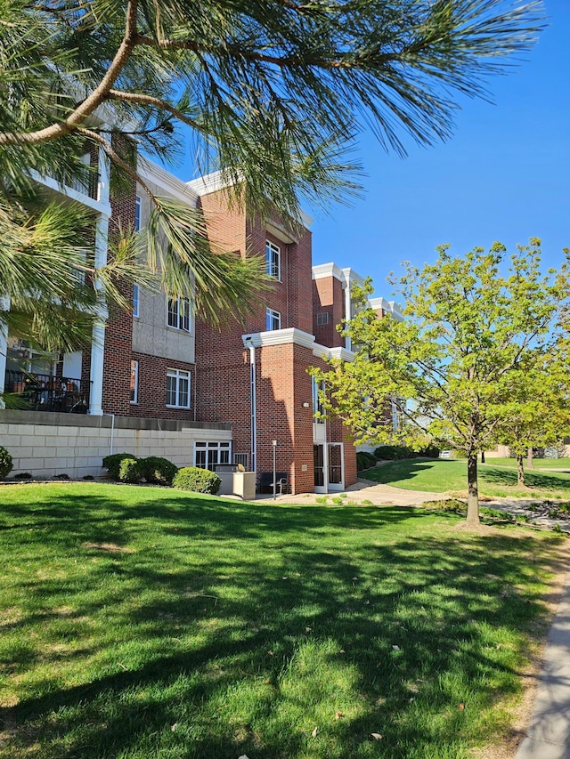 14587 Florissant Path Unit 225, Apple Valley, MN 55124 - view of home's exterior with a yard and brick siding