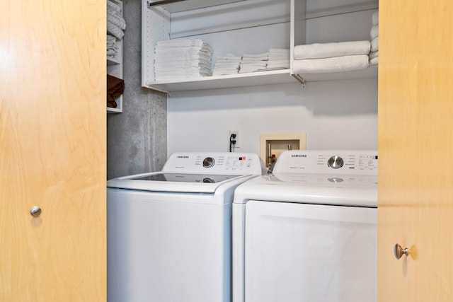 washroom featuring washing machine and dryer