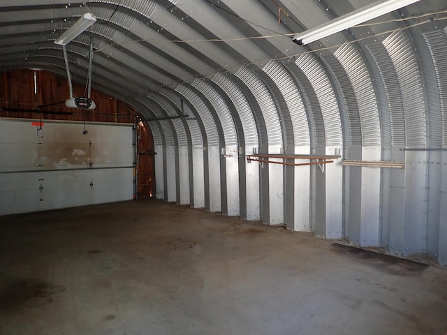 interior space with lofted ceiling and concrete floors