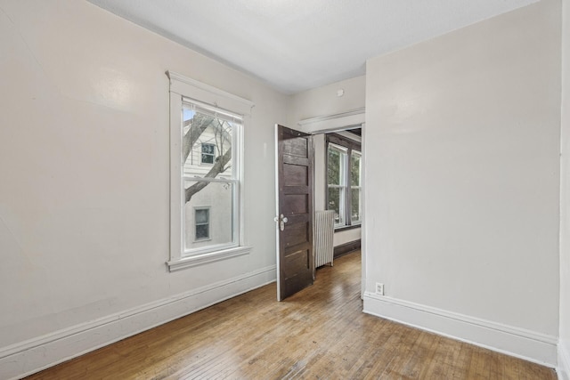 spare room with light hardwood / wood-style flooring