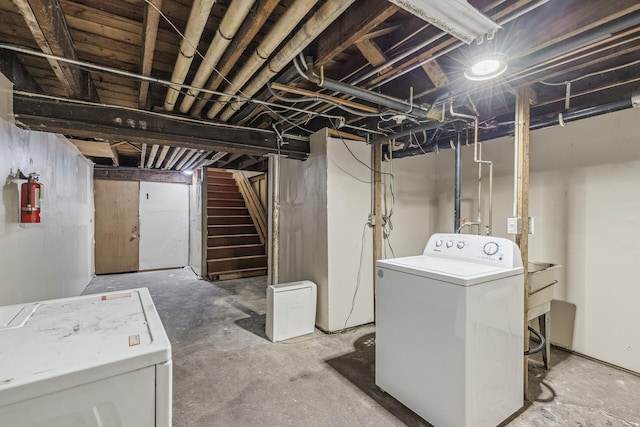 basement with separate washer and dryer