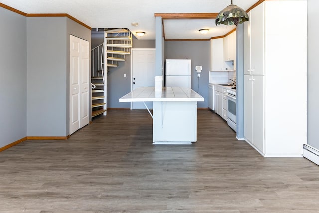 kitchen featuring white cabinetry, white appliances, ornamental molding, and wood-type flooring