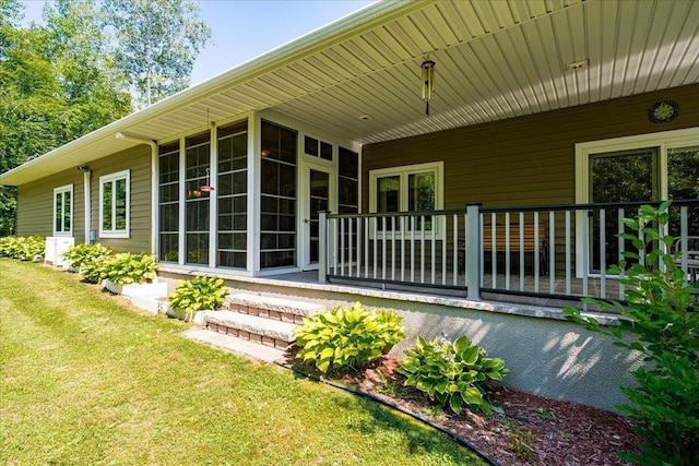 rear view of property with a lawn