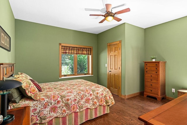 bedroom with dark wood-type flooring and ceiling fan