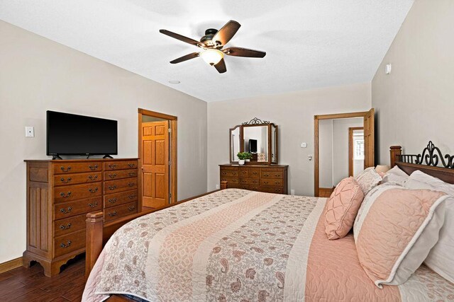 bedroom with wood-type flooring and ceiling fan