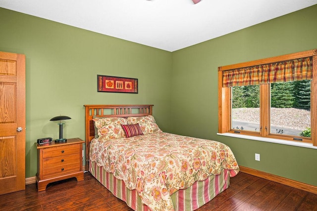 bedroom featuring dark hardwood / wood-style flooring