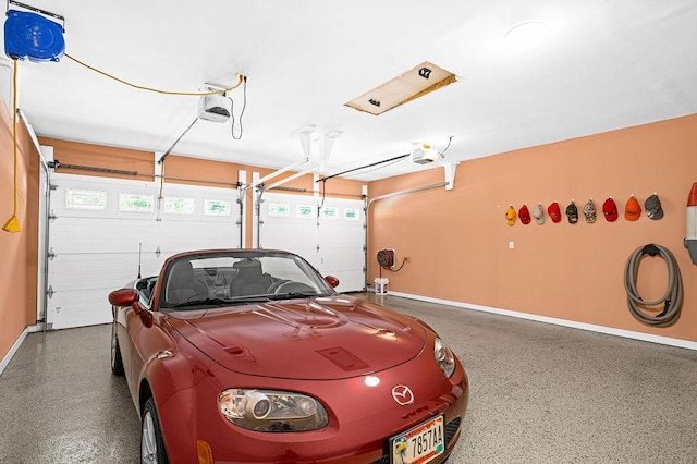 garage featuring a garage door opener