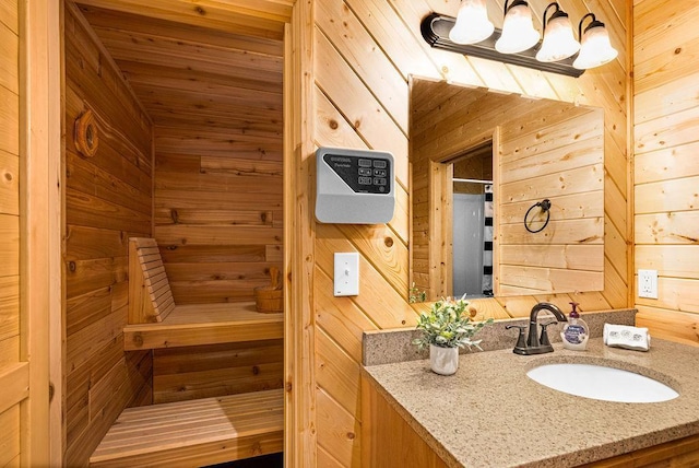 bathroom with vanity, wood ceiling, a chandelier, and wood walls