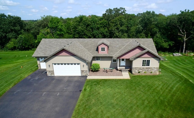 view of front of home featuring a garage and a front lawn