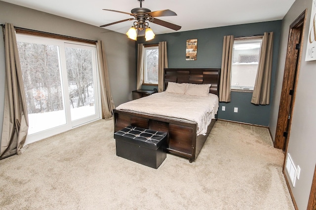 bedroom featuring ceiling fan, light carpet, and access to outside