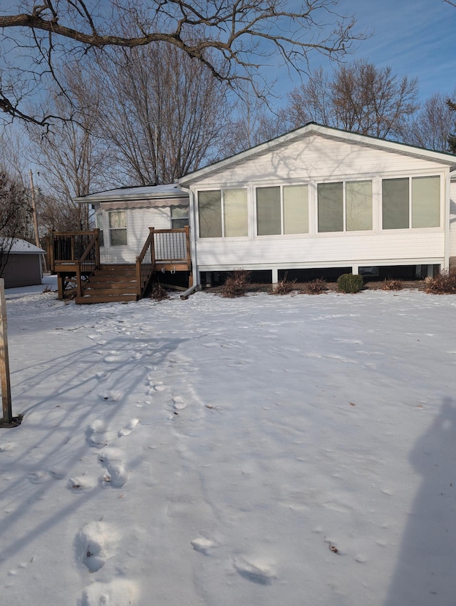 view of front of property with a wooden deck