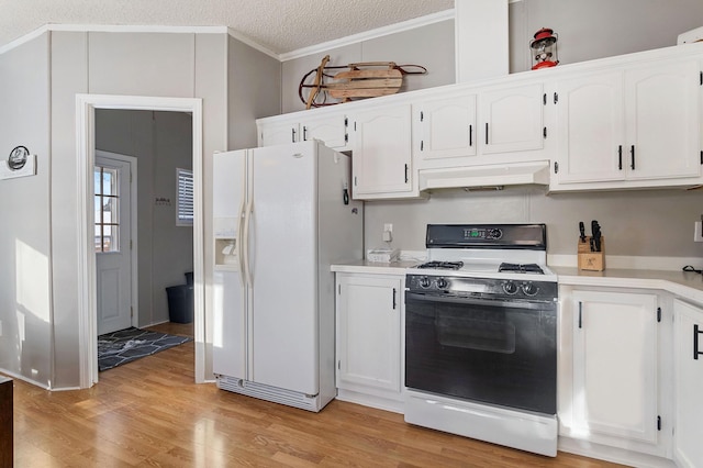 kitchen with white cabinets, gas range oven, light hardwood / wood-style floors, and white fridge with ice dispenser