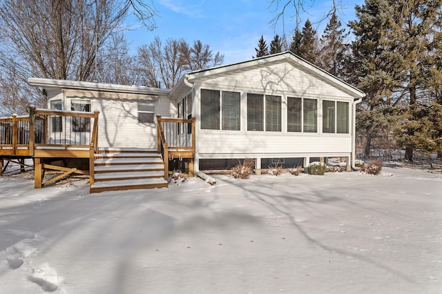 view of front of property with a wooden deck