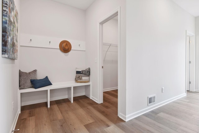 mudroom with light hardwood / wood-style floors