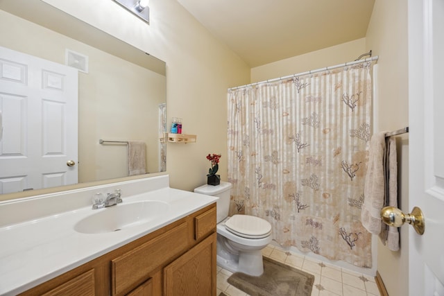 bathroom featuring tile patterned flooring, vanity, walk in shower, and toilet