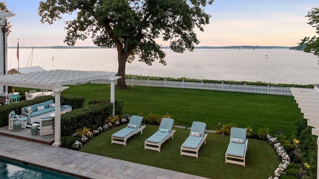 20100 Lakeview Ave, Deephaven, MN 55331 - yard at dusk with a water view, a pergola, outdoor lounge area, and a patio