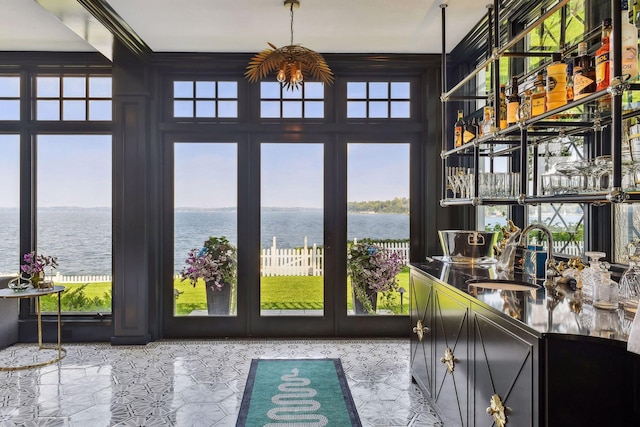 20100 Lakeview Ave, Deephaven, MN 55331 - sunroom featuring a water view, french doors, and healthy amount of natural light