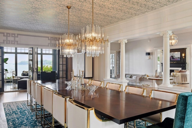 20100 Lakeview Ave, Deephaven, MN 55331 - dining space with ornate columns, ornamental molding, and a chandelier