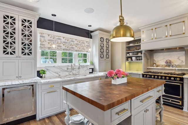 20100 Lakeview Ave, Deephaven, MN 55331 - kitchen with butcher block countertops, range with two ovens, backsplash, and open shelves