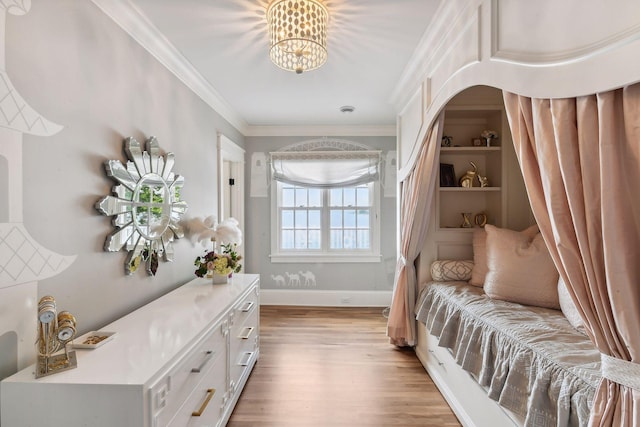 20100 Lakeview Ave, Deephaven, MN 55331 - bedroom with light wood finished floors, a chandelier, ornamental molding, and arched walkways