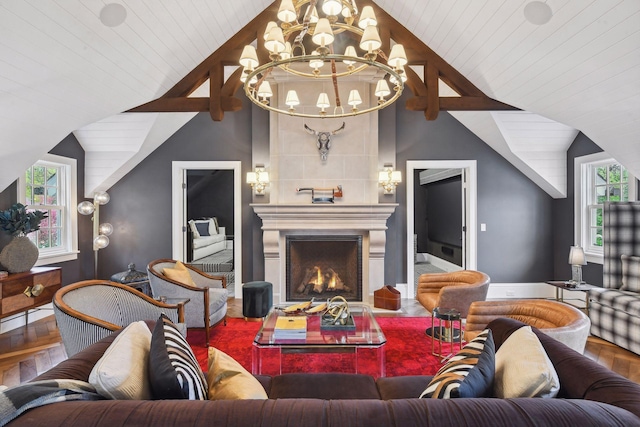 20100 Lakeview Ave, Deephaven, MN 55331 - living room with vaulted ceiling, wood finished floors, a chandelier, and a fireplace