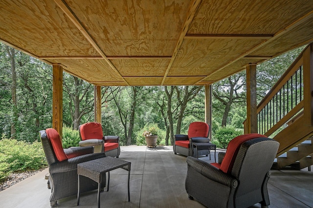 view of patio / terrace with a wooded view