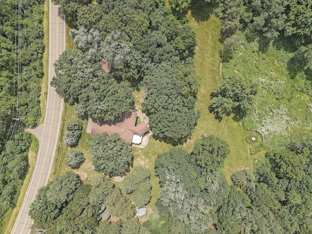 birds eye view of property with a forest view