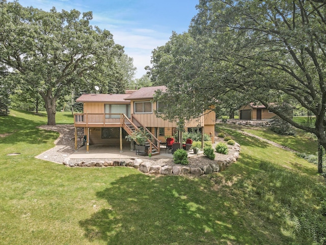 back of house with a wooden deck, stairs, a lawn, a chimney, and a patio