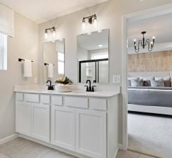 bathroom featuring a healthy amount of sunlight, vanity, and tile patterned flooring