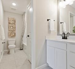 full bathroom featuring vanity, tub / shower combination, tile patterned floors, and toilet