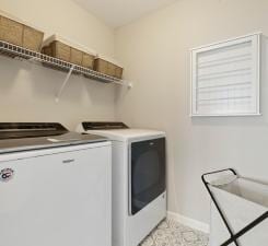 laundry area with independent washer and dryer