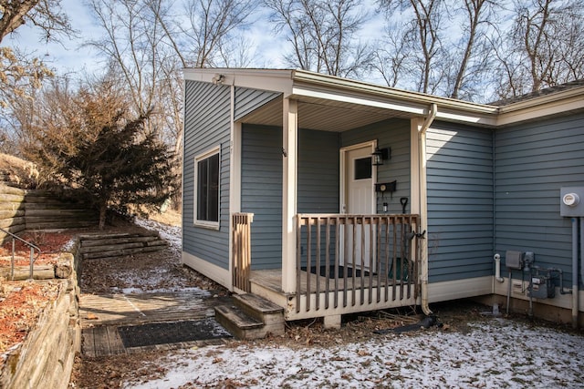 view of snow covered property entrance