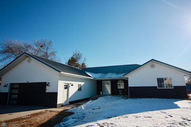 single story home with a garage