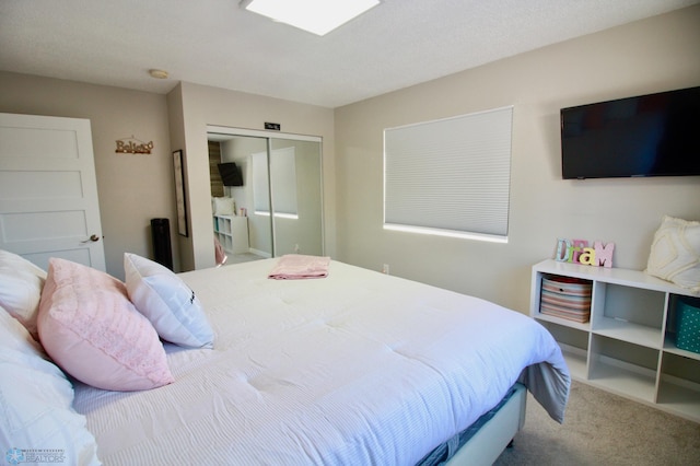 bedroom with a closet and carpet flooring