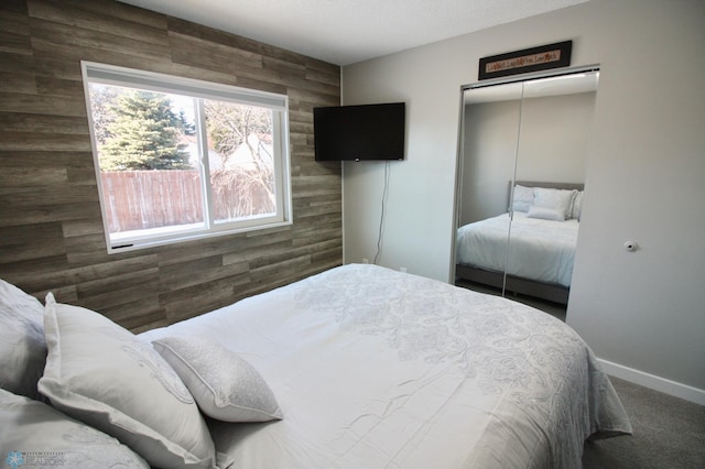 carpeted bedroom with a closet