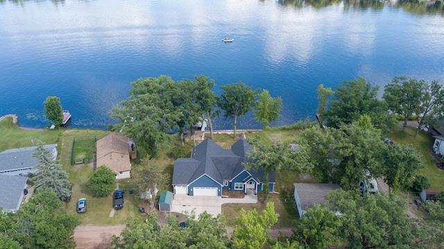 birds eye view of property with a water view