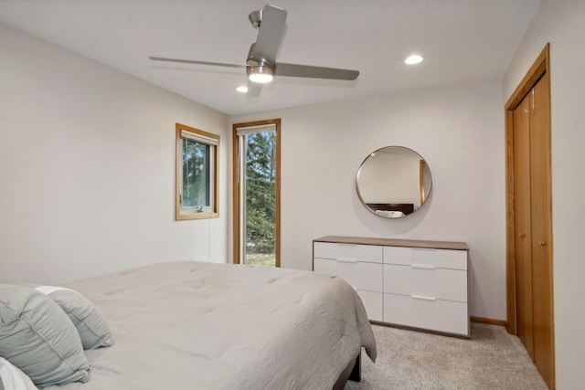 carpeted bedroom featuring ceiling fan