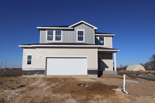 view of front of property with a garage