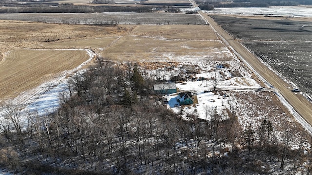 snowy aerial view featuring a rural view