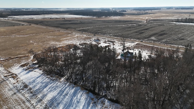 snowy aerial view featuring a rural view