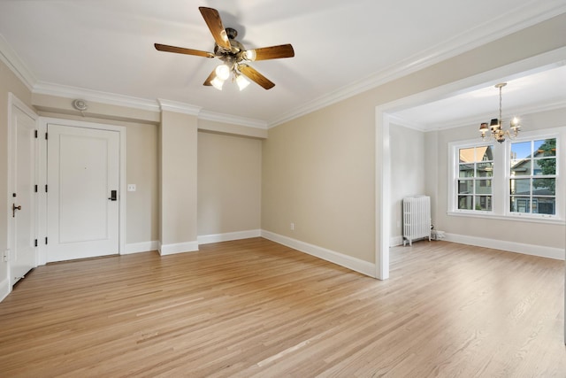 empty room featuring crown molding, radiator, ceiling fan with notable chandelier, and light hardwood / wood-style floors