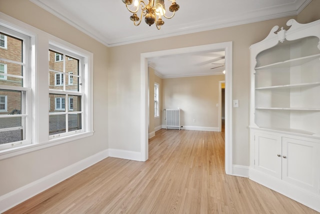 unfurnished dining area with ornamental molding, radiator, a notable chandelier, and light wood-type flooring